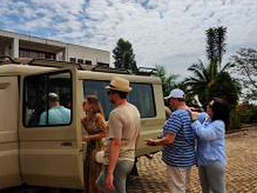 Guests boarding the Coffee Safaris van at the start of a Full Board day.